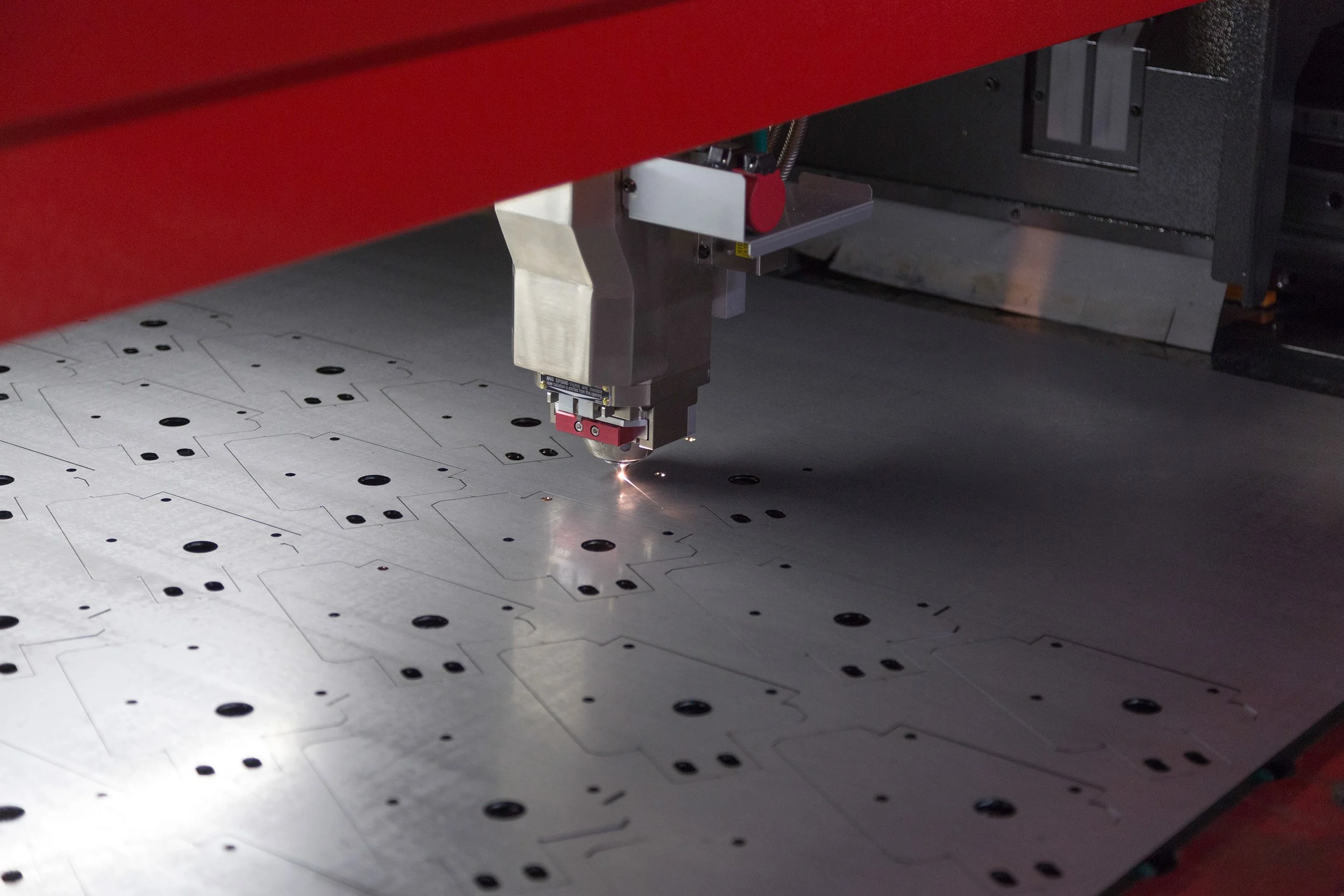 flat laser cutting a piece of steel