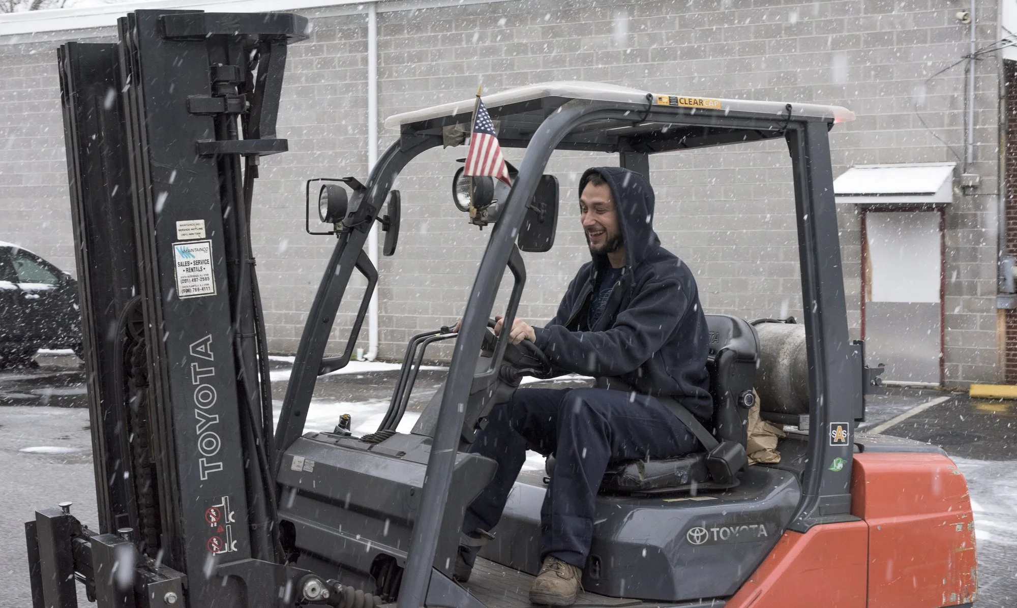 eric on a forklift in the snow